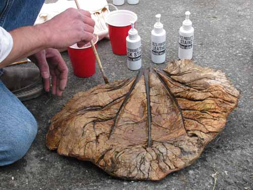 Staining a concrete leaf.